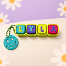 Load image into Gallery viewer, Fidget Clicker Keychain – Colorful 3D Printed Clicker with Smiley Charm
