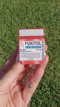 Load and play video in Gallery viewer, Fukitol Pill Bottle Badge Reel
